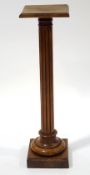A French fruitwood torchere, with reeded and turned column,