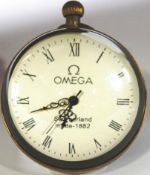An Omega 'bullseye' clock of spherical form, brass bound,