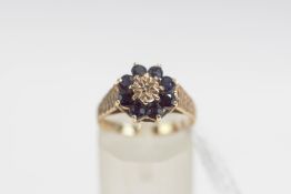 A 9 carat gold sapphire and diamond cluster ring, finger size M, 2.