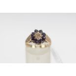 A 9 carat gold sapphire and diamond cluster ring, finger size M, 2.