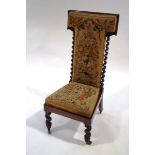 A Victorian rosewood pre-dieu chair, with tapestry upholstery,