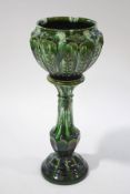 A Victorian pottery jardinere on stand with bottle green glaze,