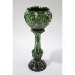 A Victorian pottery jardinere on stand with bottle green glaze,