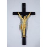 A 19th Century Continental carved ivory figure of Christ on an ebonised cross,