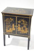 A modern lacquered and gilt cabinet with Chinoiserie decoration of figures within landscapes,