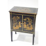 A modern lacquered and gilt cabinet with Chinoiserie decoration of figures within landscapes,