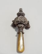 A silver and mother of pearl teether, whistle rattle, Birmingham 1923, in the antique style, 8.