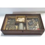 An early 20th century collectors cabinet with contents, including fossils and minerals,