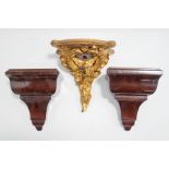 A small giltwood wall bracket, carved as a bird among a 'C' scroll and swags, 20cm high,