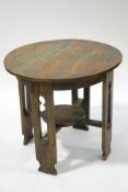 An oak Arts and Crafts circular table,