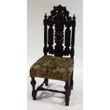 A Victorian carved and stained oak chair in the 17th century style,