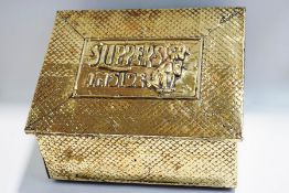 A brass slipper box with embossed pattern all over,