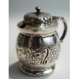 A silver mustard pot, marks rubbed, with glass liner, 85g (2.