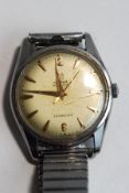 Cyma, Navystar, Cymaflex gentleman's wrist watch, the circular white dial with gilt dagger batons,