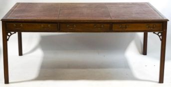 A mahogany Partner's desk with leather inset top and three drawers to either side on square legs