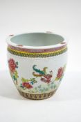 A Chinese fishbowl, decorated with exotic birds, butterflies and flowers,