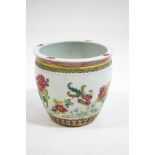 A Chinese fishbowl, decorated with exotic birds, butterflies and flowers,