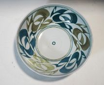 An Aldermaston pottery bowl, with stylised blue and green glazed decoration,