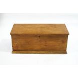 A stripped pine rectangular blanket box with two handles,