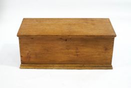 A stripped pine rectangular blanket box with two handles,