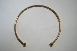 A 9 carat gold torque necklace, internal diameter currently, 12 cm,