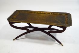 A large rectangular coffee table, with engraved brass tray top, 119.