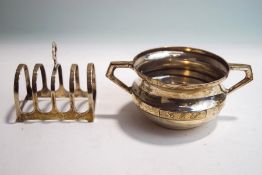 A small silver toast rack, 7.