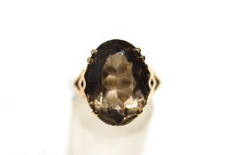 A 9 carat gold smoky quartz ring, finger size M, 6.
