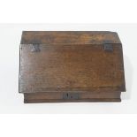 A Charles I oak ledger desk, the fall front on iron hinges enclosing shelves over five drawers,