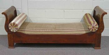 A Russian style mahogany single bed, with scroll ends,