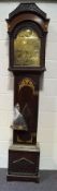 A mahogany long case clock with brass arched dial,