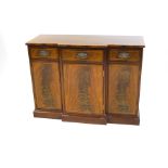 A Regency style mahogany sideboard, the rectangular breakfront top with crossbanding and stringing,