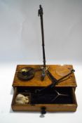 A 19th century set of apothecary scales in oak case