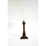 A Regency style painted metal and gilt metal mounted table lamp on rocaille base,