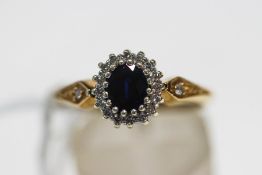 A 9 carat gold sapphire and diamond cluster ring,