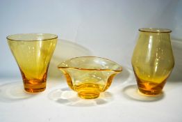 Three Whitefriars amber glass vases of various shapes,