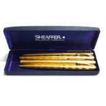 A Sheaffer fountain pen and matching ballpoint pen; and a Parker fountain pen and ballpoint pen set;