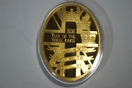 A '1936 Year of The Three Kings' oval commemorative medallion