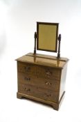 A Victorian pine dressing table with original simulated oak paintwork,