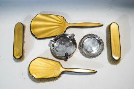 A silver and yellow enamel mounted dressing table set, Birmingham 1913, a silver pin tray,