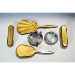 A silver and yellow enamel mounted dressing table set, Birmingham 1913, a silver pin tray,