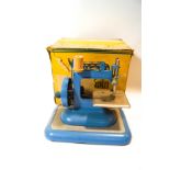 A child's Vulcan sewing machine in original box