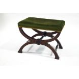 A 19th century mahogany X-frame stool, upholstered in green velour,