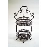 An ornate French metal two tier vegetable rack,