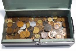 A tin of mixed coins,