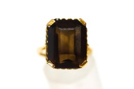 An 18 carat gold single stone smoky quartz dress ring, finger size L, 6.