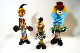 Three Murano glass figures of clowns,