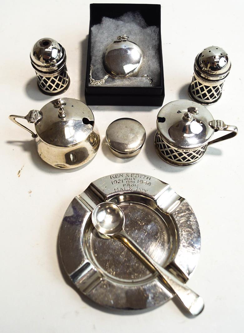 A three piece silver pierced cruet set,