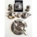 A three piece silver pierced cruet set,