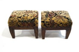 A pair of 1920's carpet upholstered footstools